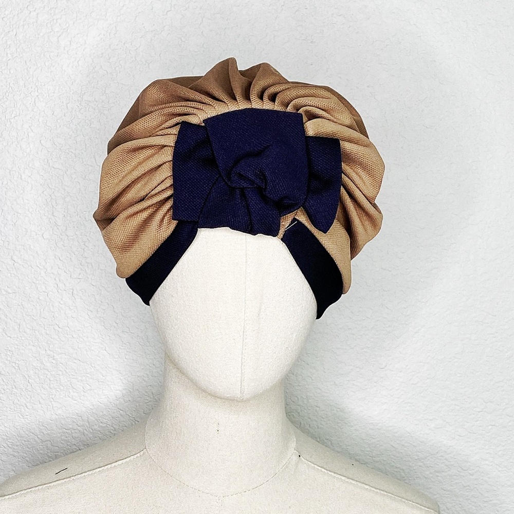 Chic Tan and Black Turban Hat with Pleated Design